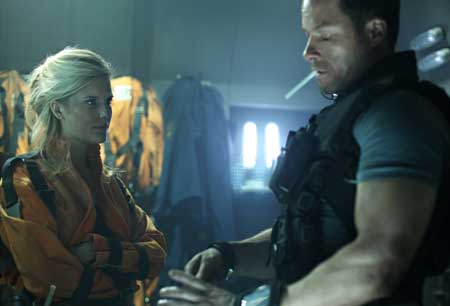 Maggie Grace and Guy-Pearce in LOCKOUT