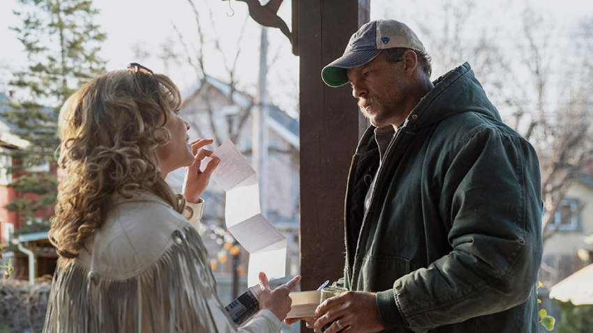 Alan Ritchson and Hilary Swank in Ordinary Angels movie